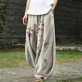 Denise – Beige Wide-Leg Trousers with Red Leaf Print