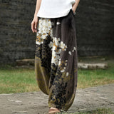 Delphine – White Wide-Leg Trousers with Floral Print